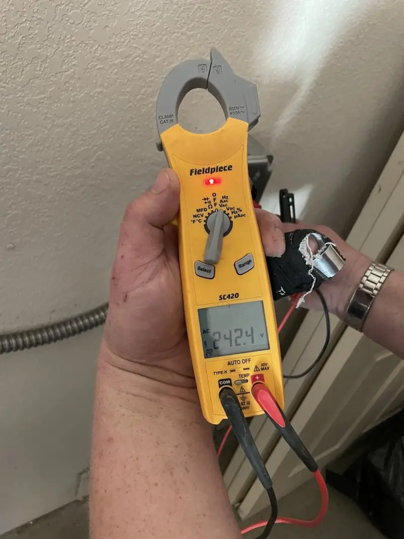 Voltage testing with clamp meter during Outlet Installation in Hartsville